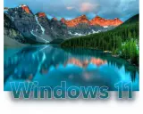 Bergsee mit Spiegelung, Wald und dem Schriftzug "Windows 11". Ein visueller Unterschied zu Windows 10.