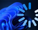 Blauer Windows 11 Hintergrund mit Ladeanimation. Bereit, kostenlos Windows 10 herunterladen?