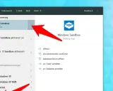 Roter Pfeil zeigt auf "Windows Sandbox" in der Suche. Die Windows 10 Sandbox ist eine Desktop-App für sicheres Testen.